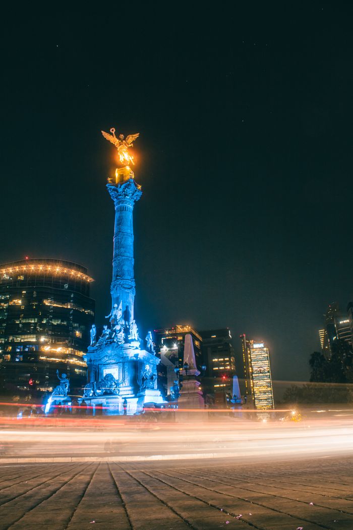 Services Mesmerizing long-exposure shot of the Angel of Independence at night in Mexico City.